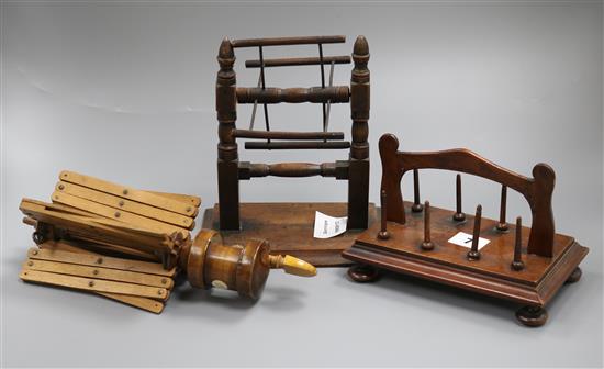 An early 19th century mahogany reel stand and two silk / wool winders Tallest 20cm.